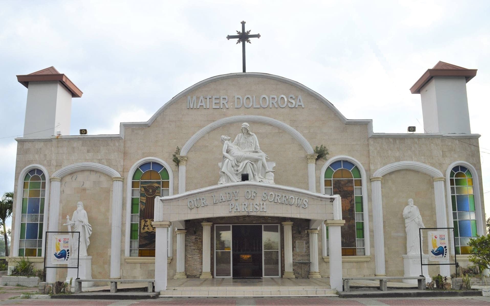 The parish church of Mater Dolorosa in Barangay Dolores, Capas — its arched facade crowned with a cross, the Pietà set above the entrance